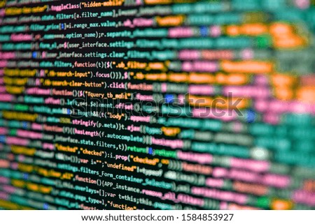 Software technology background showing programming source code on computer screen.