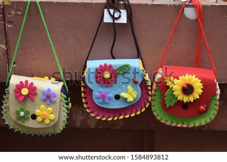 Three Colorful Leather Bags with Flowers