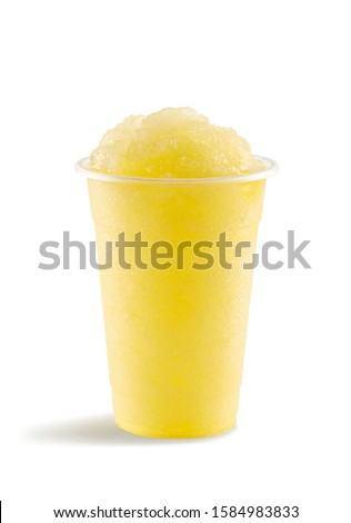 Food photography of pineapple slushie slushy frappe in clear plastic take away cup on white background
