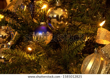 Close-up of decorations on christmas tree during christmas time at home