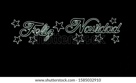 Merry Christmas text lights with stars and black background