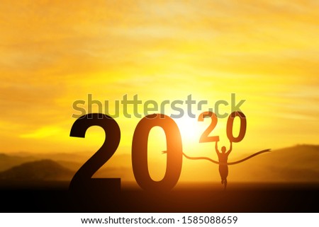 silhouette of Man Winner running  in 2020 text for happy new year concept