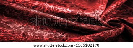 relief pattern, composite textiles, red silk fabric, with a floral pattern, unusually pleasant visual sensations: slippery, coolness, softness; beautiful appearance, unique luster;