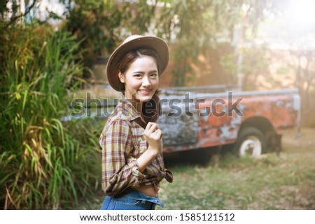 Asian woman wearing a cowboy hat and outdoor portraits.