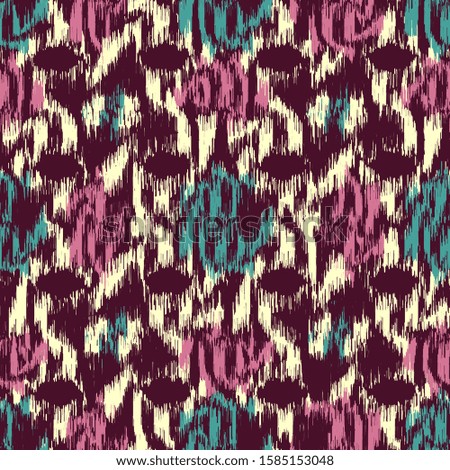 Seamless abstract ikat pattern with colorful strokes.

