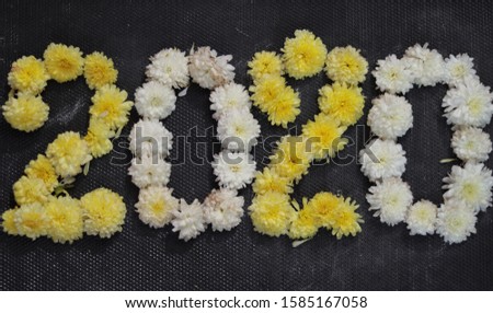 create 2020 with flowers on black background