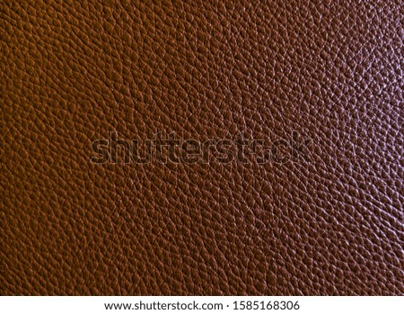 Brown leather texture closeup background. Texture of genuine leather. Matte Brown Artificial Leather Texture. Elegant dark brown leatherette background. Dermantin texture. Copy space.