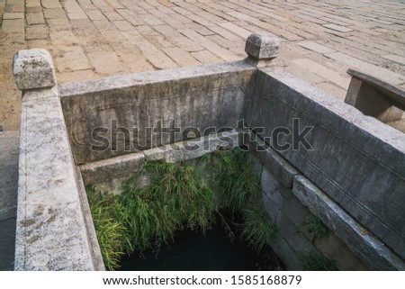Take photos of a well in Huishan ancient town, Wuxi, China