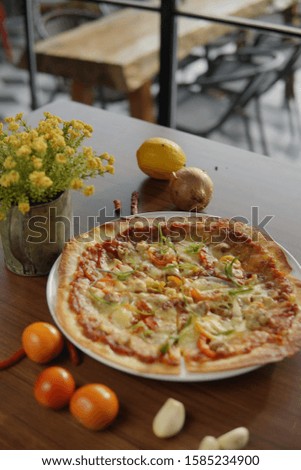 Pizza is a savory dish from Italy a type of round and flat bread, which is baked in the oven and usually covered in tomato sauce and mozzarella cheese
