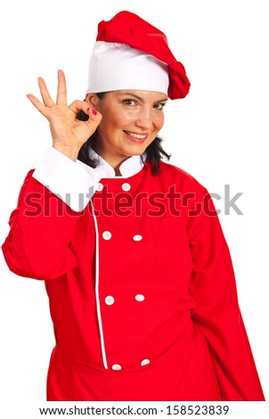 Happy chef woman showing okay sign hand gesture isolated on white background