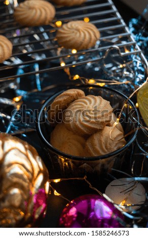 handmade cookies. Christmas mood. new year tree balls and lights. bokeh