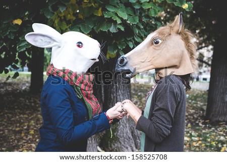 horse and rabbit mask women in the park autumn Royalty-Free Stock Photo #158525708