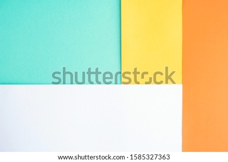 Abstract background of four trending colors Orange Tiger, Mimosa, white, Biscay green. Mint, white, yellow and orange. Geometric background.