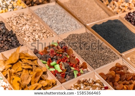 Food market with various colorful fresh fruits and seeds. Healthy and organic food with vitamins. Vegetarian concept. Dried food. 