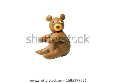 Statues like cute animals for children. Molding from plasticine. Cartoon characters, Bear isolated on white background with clipping path.