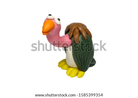 Statues like cute animals for children. Molding from plasticine. Cartoon characters Vulture isolated on white background with clipping path.