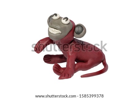 Statues like cute animals for children. Molding from plasticine. Cartoon characters, Monkey isolated on white background with clipping path.
