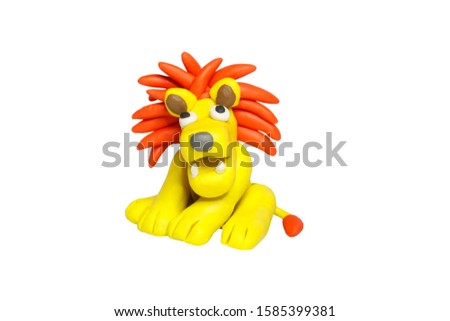 Statues like cute animals for children. Molding from plasticine. Cartoon characters, Lion isolated on white background with clipping path.