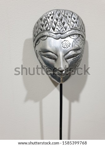 a field shaped mask made of metal