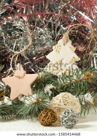 Holiday christmas image.
Christmas decorations on snow close-up.