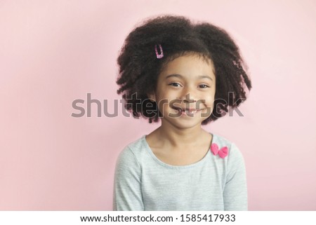Happy adorable african american child girl isolated on pastel background. 
Laughing face. Real emotions.