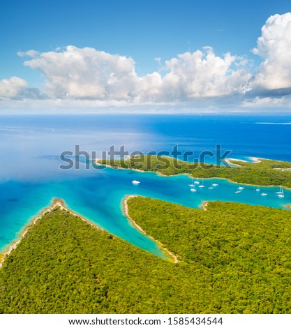 Great aerial view of the blue lagoon on sunny day. Location Kvarner Gulf, Punta Kriza, Cres island, Croatia, Europe. Drone photography. Exotic place, nature wallpapers. Discover the beauty of earth.
