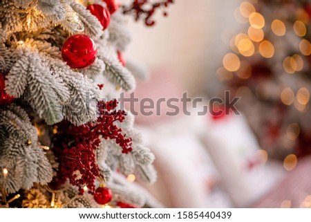 red Christmas holiday decorations with lights and garland