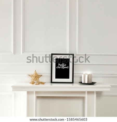 White wooden fireplace shelf of free space for your decoration.Home interior with white wall and window sun light.Copy space and frames of free space for your text.Xmas decoration and christmas time.