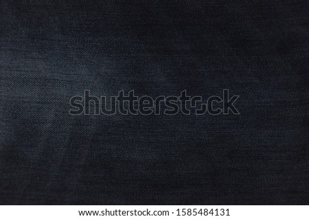 Jeans background, dark blue jeans fabric texture, vintage style blue denim, blue pattern textile for design, space for text, fiber detail backdrop