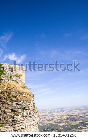 Part of Castello di Venere in Erice, Sicily, Italy on the cliff and a landscape from the mountain