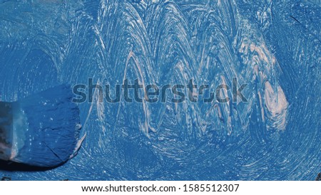 Artist copyist paint seascape with ship in ocean. Craftsman decorator draw as boat sail on blue sea with acrylic oil color. Draw finger, brush, knife palette. Indoor. Close up cinematic look.