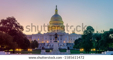 Panoramic image of the Capitol of the United States in morning light. Royalty-Free Stock Photo #1585611472