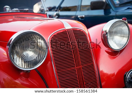 detail of red veteran car Royalty-Free Stock Photo #158561384
