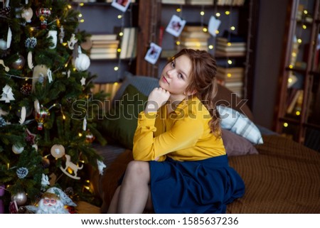 teen girl in the house dressed up for Christmas