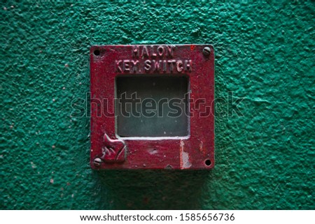 Fire system with " MALON KEY SWITCH" wording and flame sign