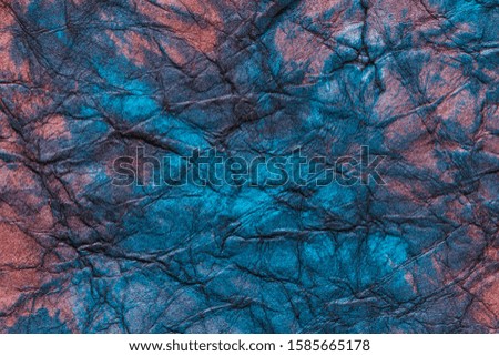 blue and red colored rough paper surface macro close up