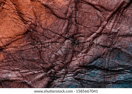 blue and red colored rough paper surface macro close up