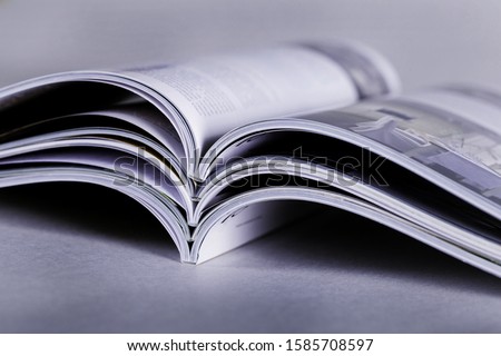 Pile of Open magazines, toned image Royalty-Free Stock Photo #1585708597
