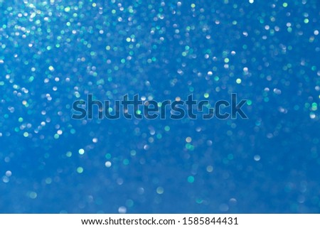 Blue beautiful festive blurred background. Concept for the holiday. The trend of the year.