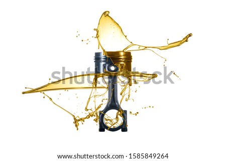 Piston and connecting rod are thrown with oil. Engine oil concept - Oil Splash - isolated on white Background Royalty-Free Stock Photo #1585849264