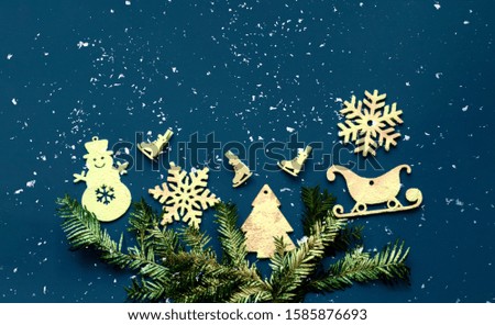 Decorative white christmas decorations on classic blue background. Pattern for holiday paper packaging. Close-up, copy space