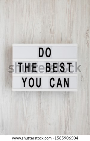 'Do the best you can' words on a modern board on a white wooden background, top view. Overhead, from above, flat lay. 