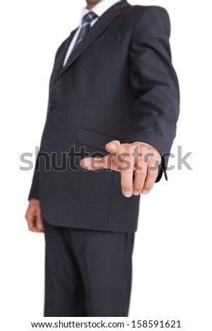 Stylish businessman pointing the finger at camera on white background