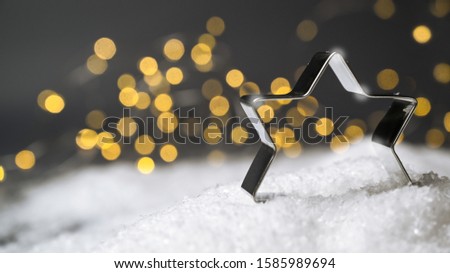 Christmas star with snow and candle lights