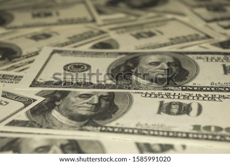 Photo of hundred dollar bills close up