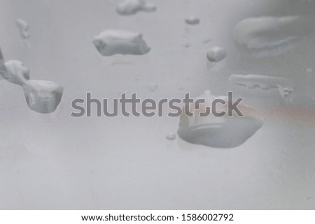 macro view of water bubbles on the pixel screen of the gadget surface with text, technology colnept