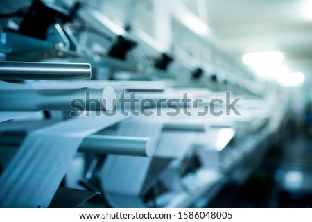 Machines for packing products Within the factory, sterile beauty industry in order to maintain maximum cleanliness.shallow focus effect. Royalty-Free Stock Photo #1586048005