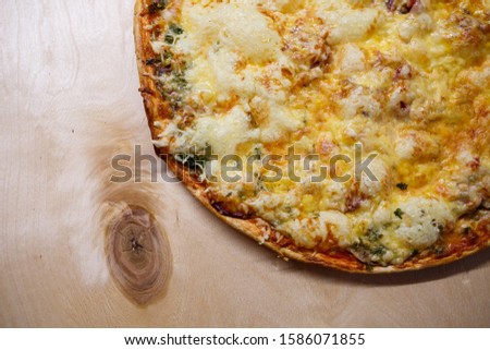 Home cooked pizza on a wooden board