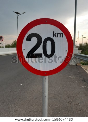 A vehicle speed limit sign