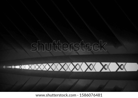 Double expoure of glass panels. Black and white close-up photo of modern architecture fragment. Transparent abstract architectural, industrial or technological background in hi-tech style.
